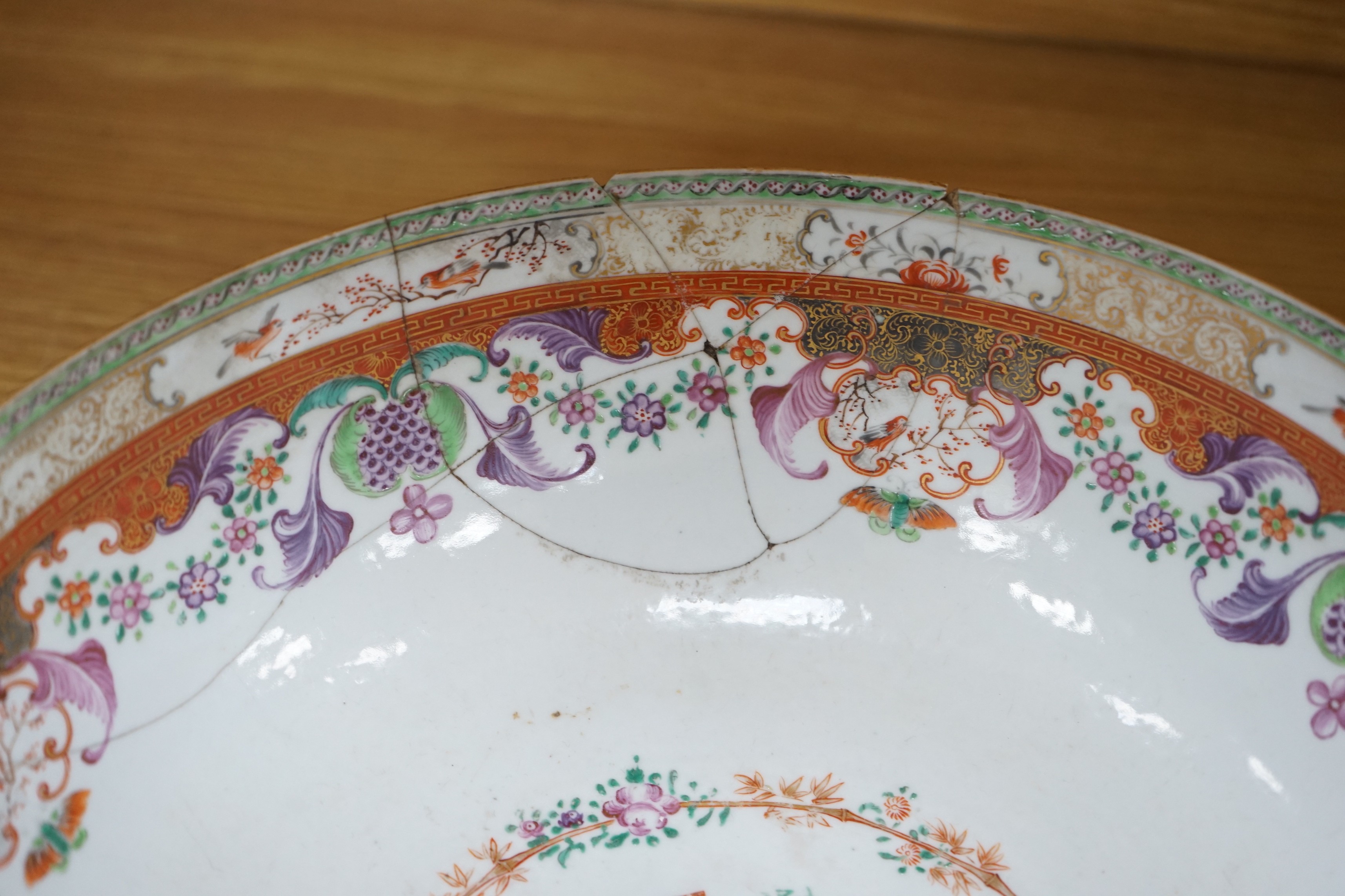 An 18th century Chinese export famille rose ‘mandarin’ punch bowl, 31cm diameter (af)